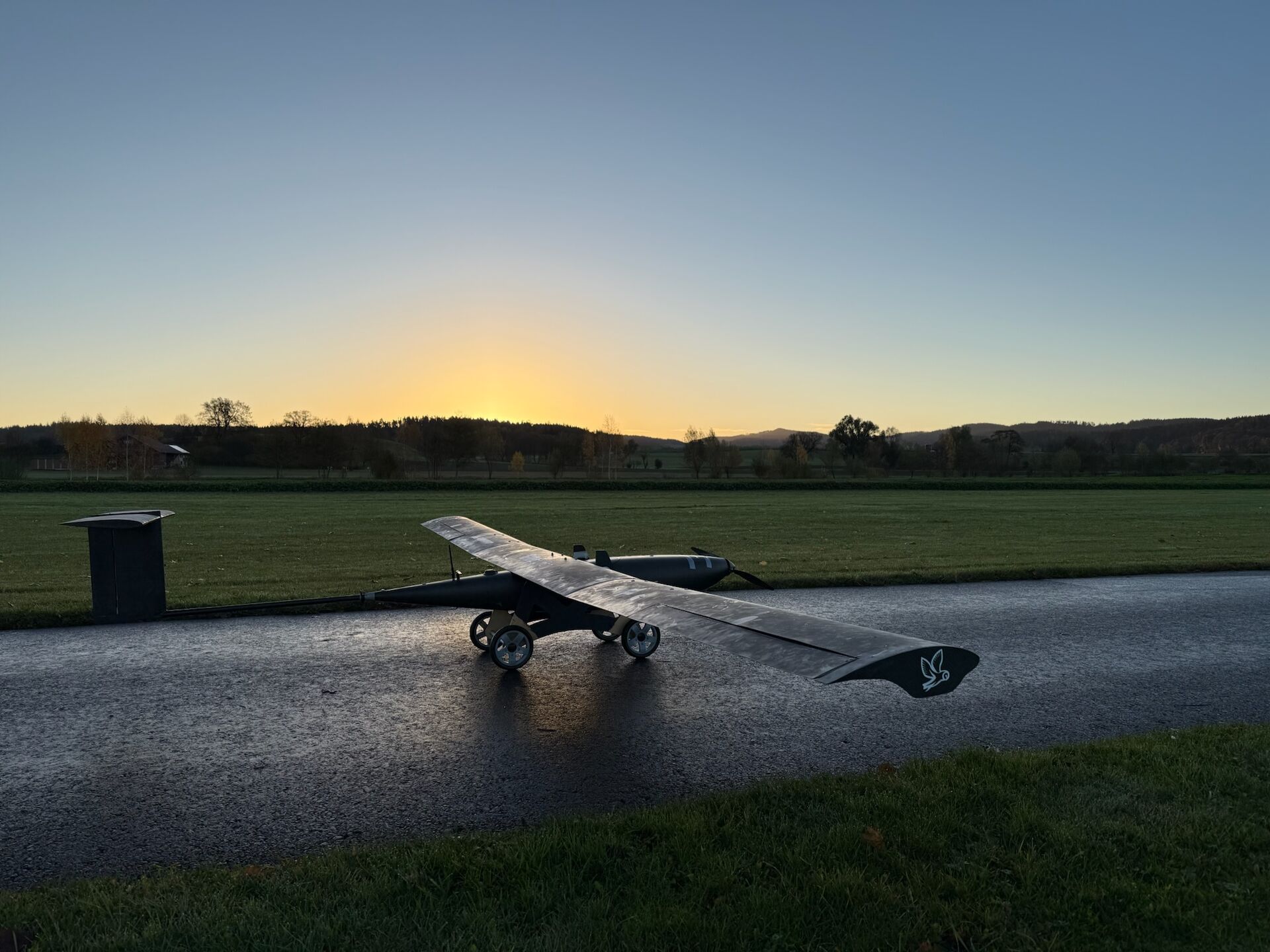 NOCTUA aircraft wing covered in dew at dawn